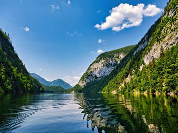 Scenic view of lake and mountains against sky