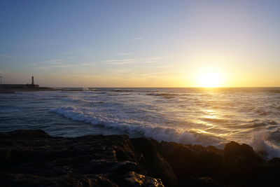 Scenic view of sea against sky during sunset