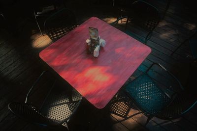 High angle view of empty chairs and table in restaurant