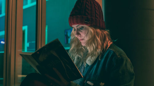 Woman looking at open book