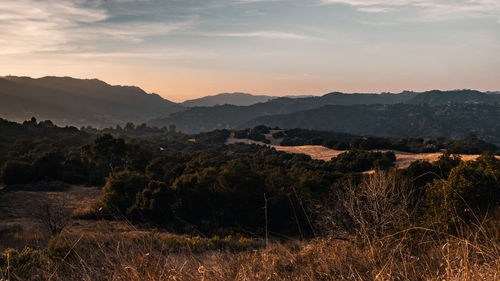 Scenic view of mountains against sky during sunset