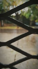 Close-up of fence against blurred background