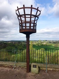 Gazebo on field against sky