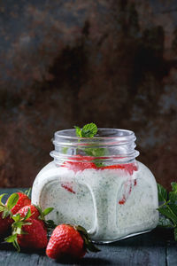 Close-up of strawberries in glass jar