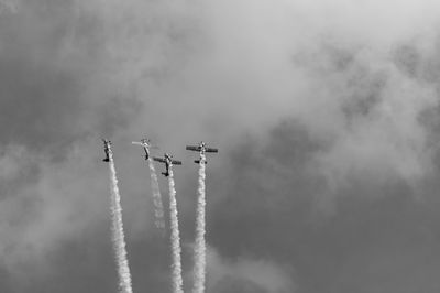 Low angle view of airshow in sky