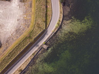 High angle view of road by trees in city