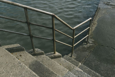 High angle view of staircase by swimming pool