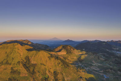 Scenic view of mountains against sky during sunset