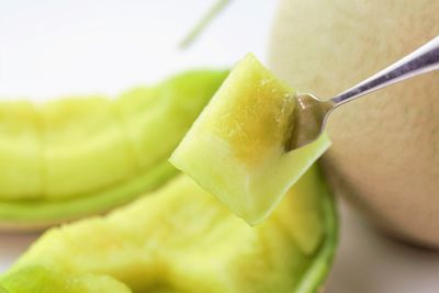 Close-up of melon slice on table