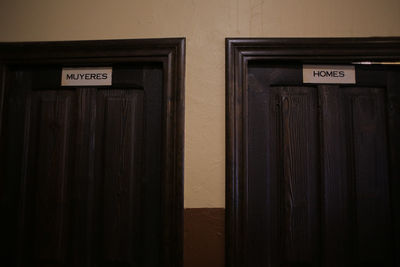 Close-up of text on wooden door
