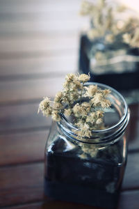 Close-up of glass of jar on table