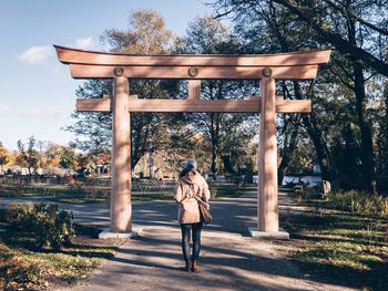 Full length rear view of a man walking outdoors