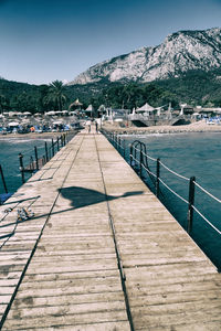 Pier over sea against sky