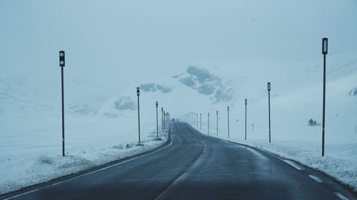 Empty road against clear sky