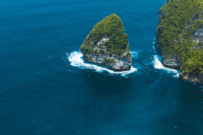 High angle view of rock in sea