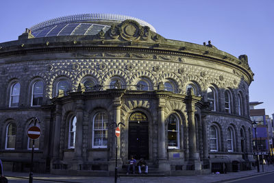 Facade of historic building against blue sky