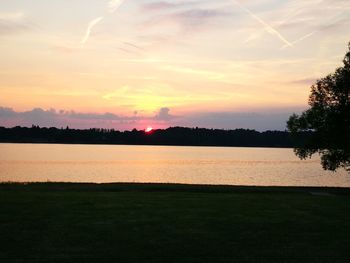 Scenic view of lake against sky during sunset