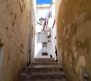 Steps amidst weathered wall