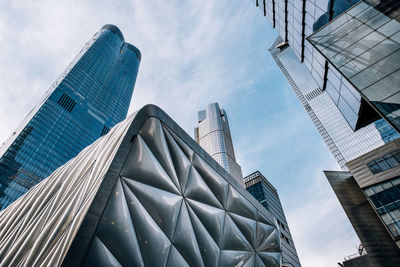 Low angle view of modern buildings against sky