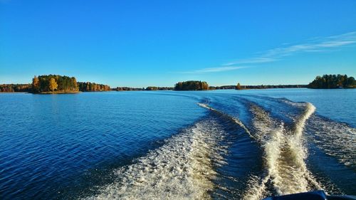 Scenic view of sea against blue sky