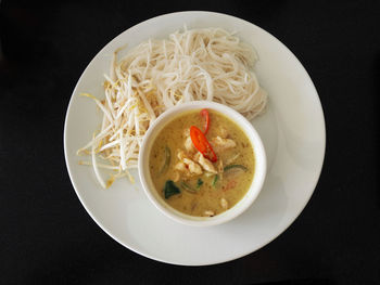 Green curry serve with rice noodle , thai famous menu