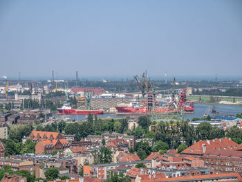 High angle view of buildings in city against clear sky