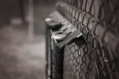 Close-up of padlock on fence