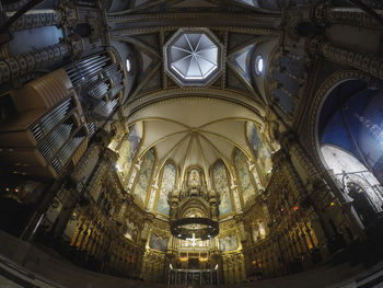 Low angle view of illuminated ceiling of building