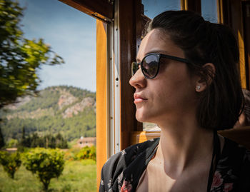 Portrait of young woman looking away