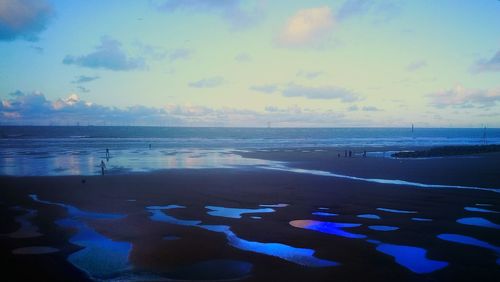 Scenic view of sea against sky at sunset