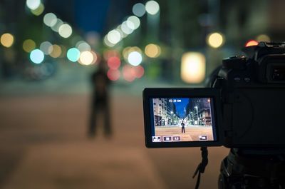 Close-up of digital camera at night