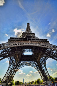 Low angle view of tower against cloudy sky