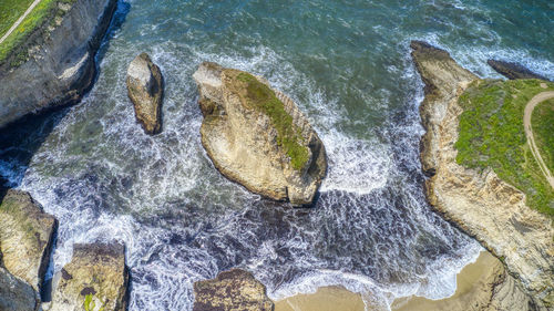 High angle view of water flowing through rocks