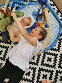 High angle view of mother and daughter at home