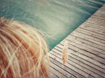 High angle view of man on pier over sea