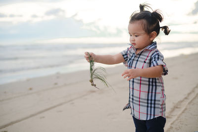 Girl standing on beach