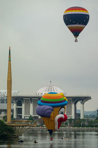 View of hot air balloons in city