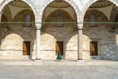 Woman in green dress exploring istanbul on vacation