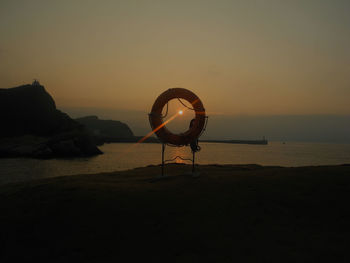 Scenic view of sea against sky at sunset