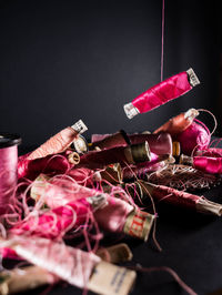 Toys on shelf against black background