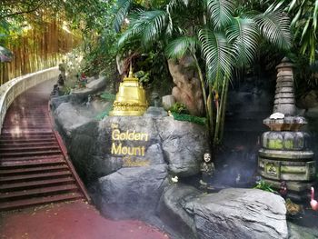 View of buddha statue by trees