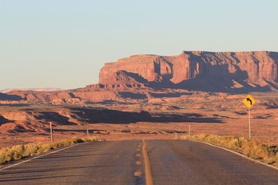 Empty road passing through mountain