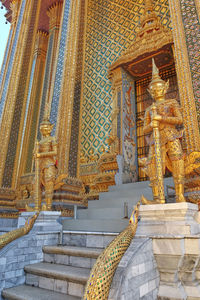 Statue of temple against building