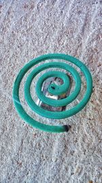 High angle view of spiral pattern on metal