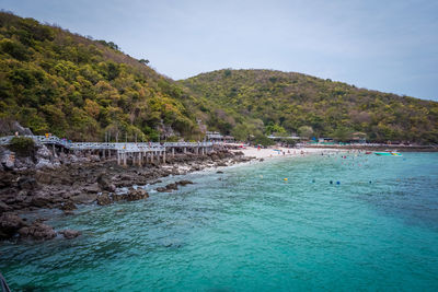 Scenic view of swimming pool by sea against sky