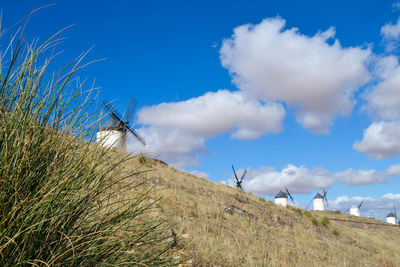 Scenic view of land against blue sky