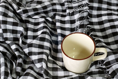 High angle view of coffee cup on table