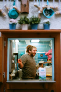 Man looking at camera at home
