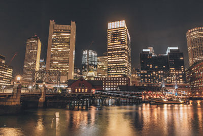 Illuminated buildings in city at night