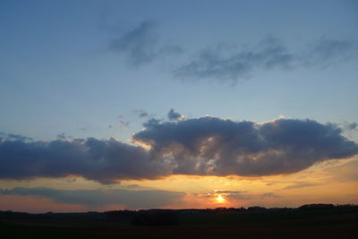 Scenic view of silhouette landscape against sky during sunset
